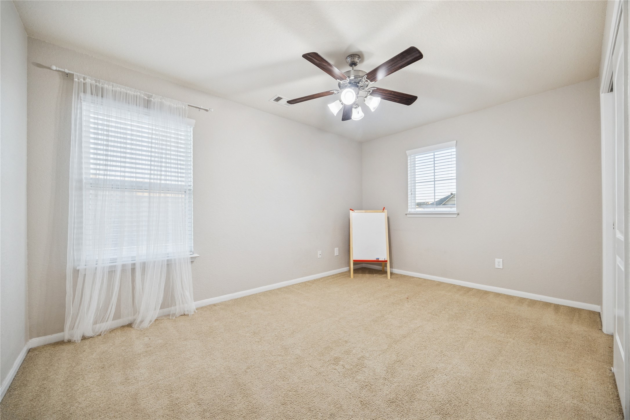 3026 Currier Court Rosenberg, TX 77471 - Photo 18 of 22 a view of an empty room with a window