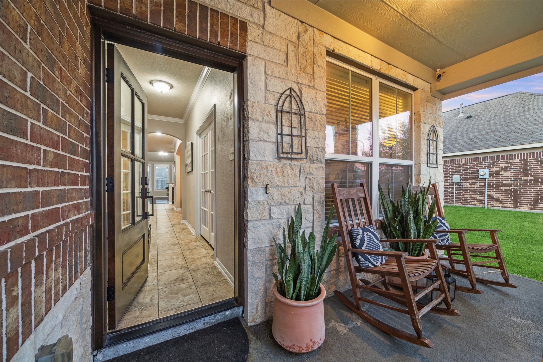 3026 Currier Court Rosenberg, TX 77471 - Photo 4 of 22 a view of a balcony with chair and potted plants