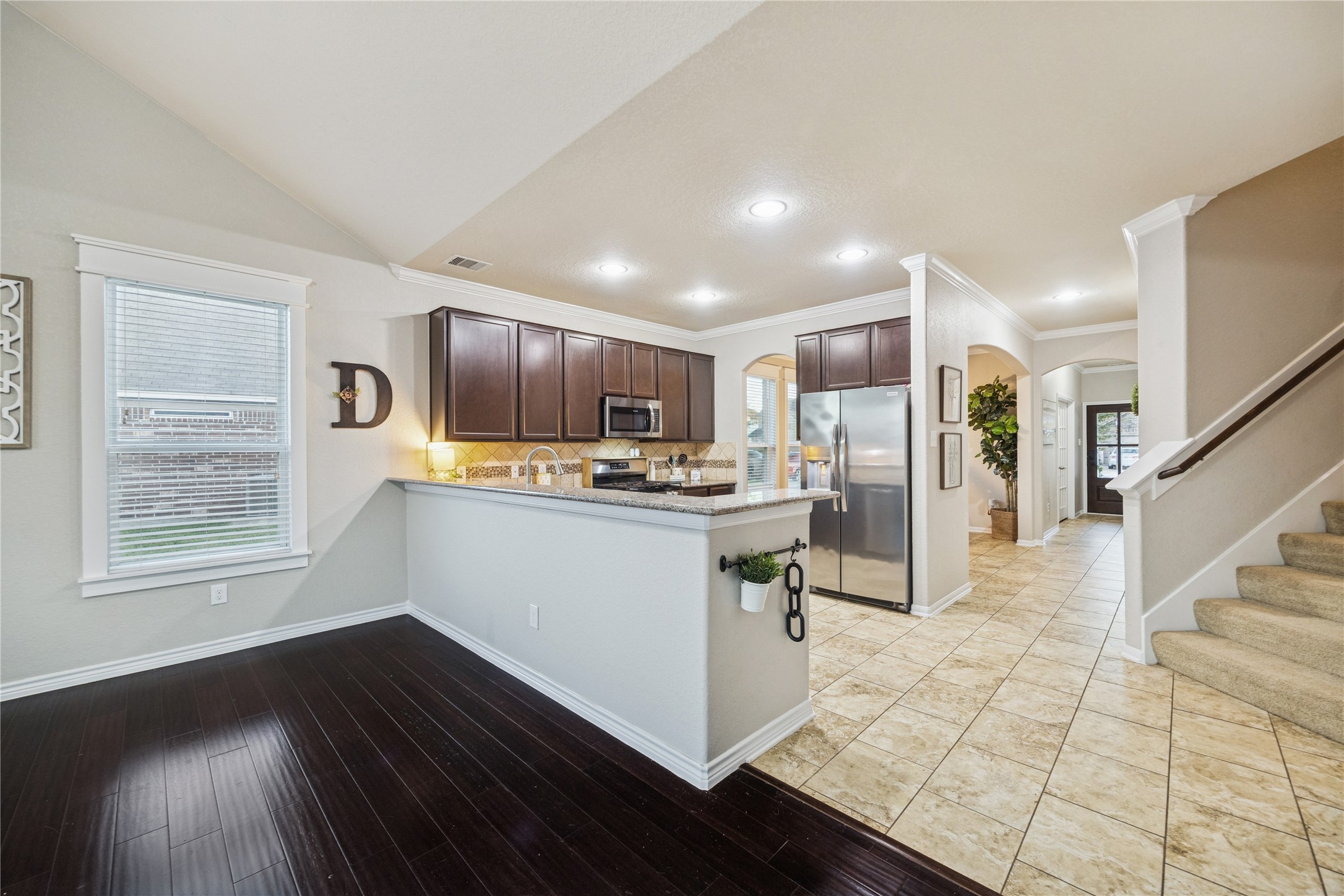 3026 Currier Court Rosenberg, TX 77471 - Photo 9 of 22 a kitchen with stainless steel appliances granite countertop a refrigerator sink and cabinets