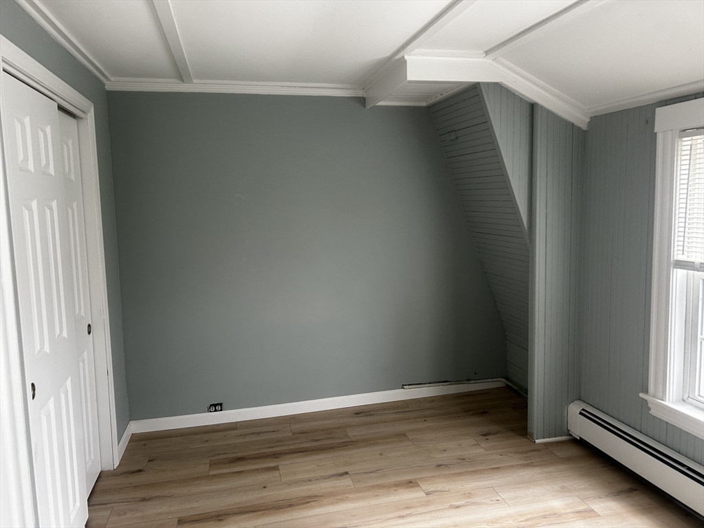 8 Beaver Dam Road, Unit B Scituate, MA 02066 - Photo 9 of 14 a view of an empty room with wooden floor and a window