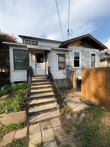 a front view of a house with a porch