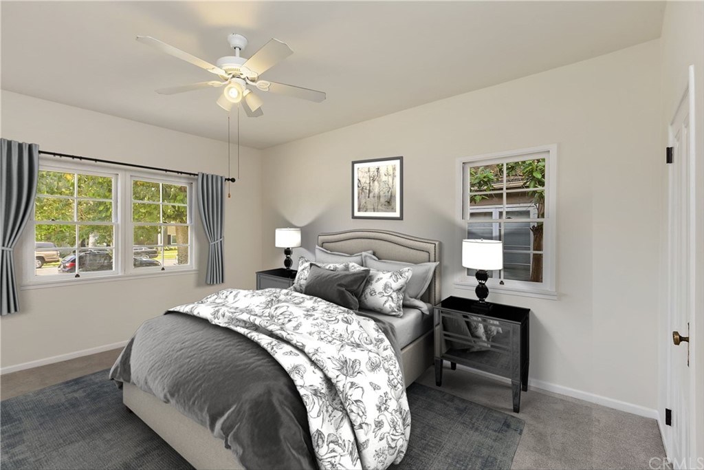6650 Palm Avenue Riverside, CA 92506 - Photo 15 of 20 a bedroom with a bed and a chandelier