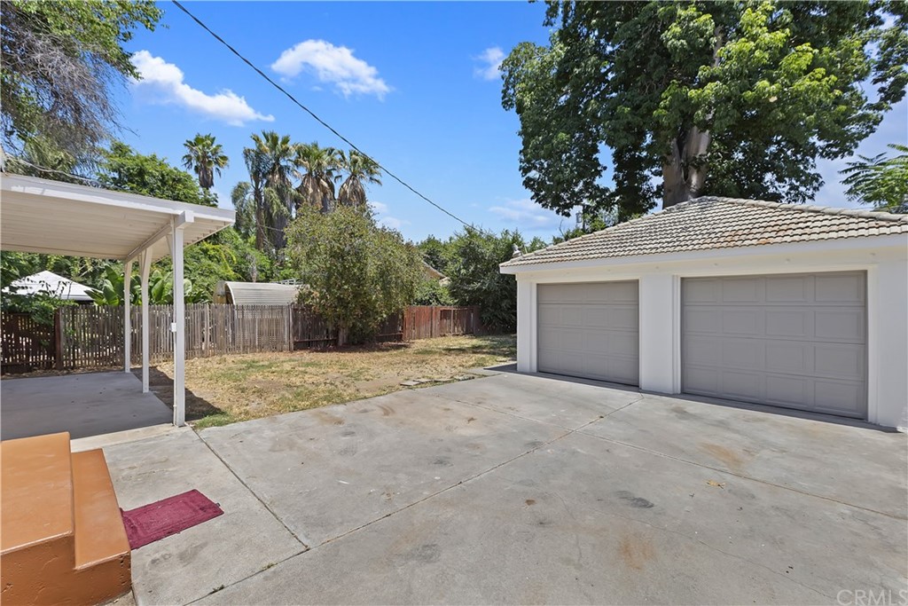 6650 Palm Avenue Riverside, CA 92506 - Photo 17 of 20 a front view of a house with a yard and garage