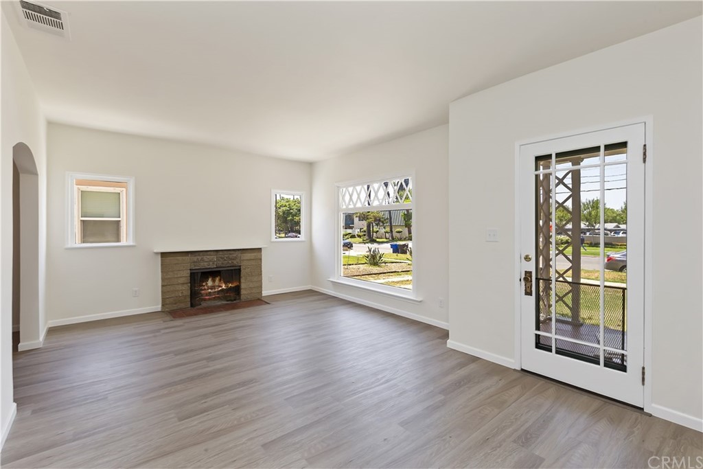 6650 Palm Avenue Riverside, CA 92506 - Photo 4 of 20 an empty room with floor to ceiling window and wooden floor