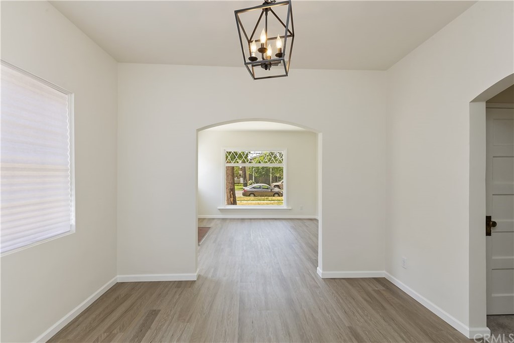 6650 Palm Avenue Riverside, CA 92506 - Photo 8 of 20 an empty room with wooden floor fan and windows