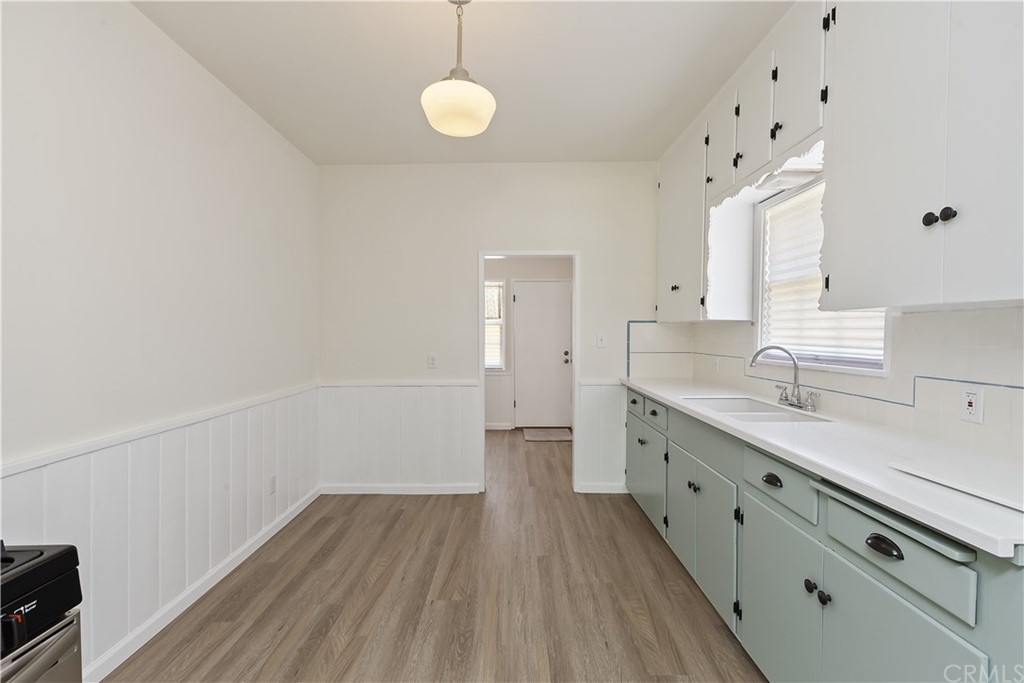6650 Palm Avenue Riverside, CA 92506 - Photo 9 of 20 a view of a kitchen with wooden floor and electronic appliances