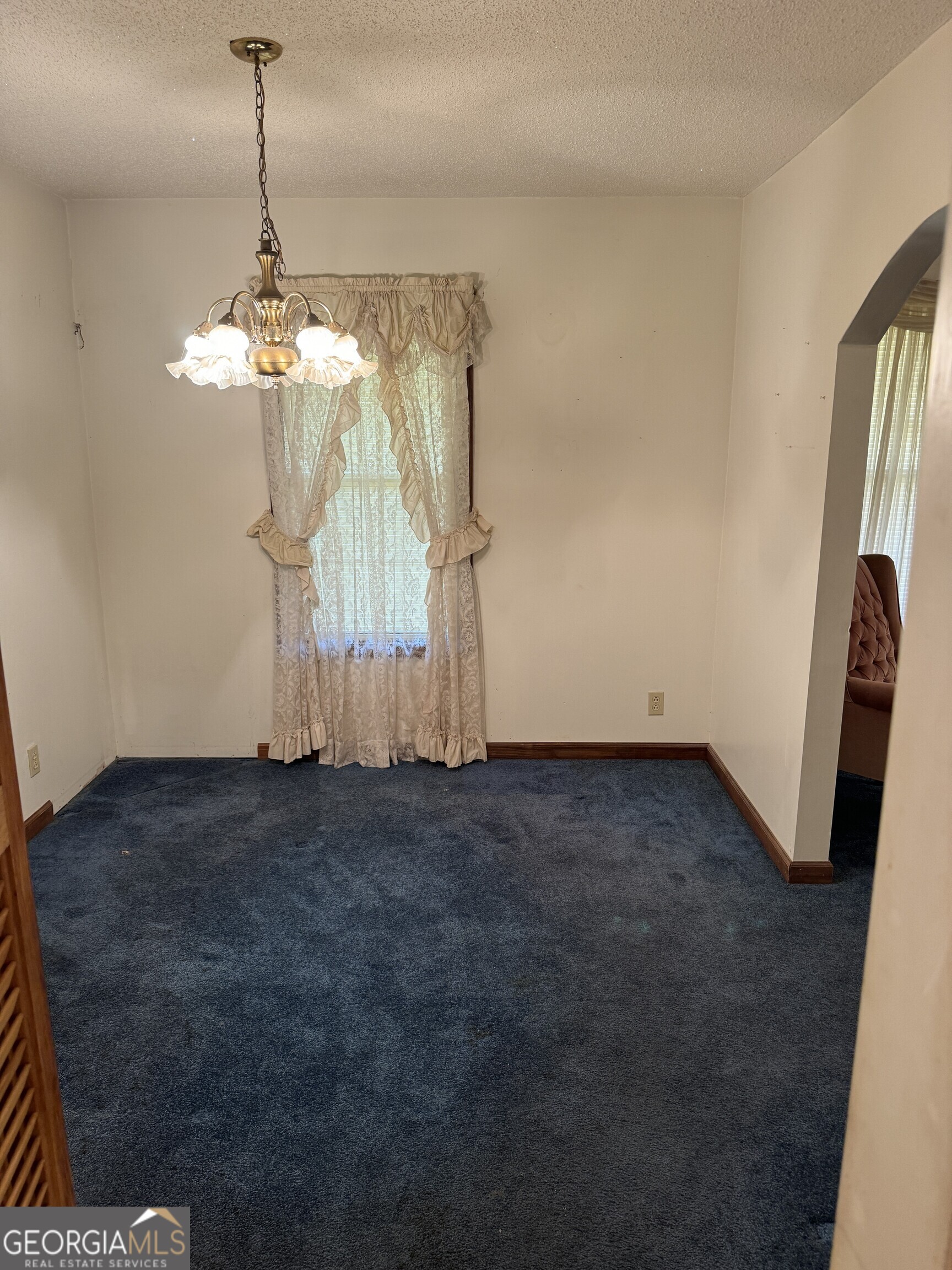 1936 Cedar Grove Road Soperton, GA 30457 - Photo 16 of 43 a view of a chandelier in big room and chandelier fan