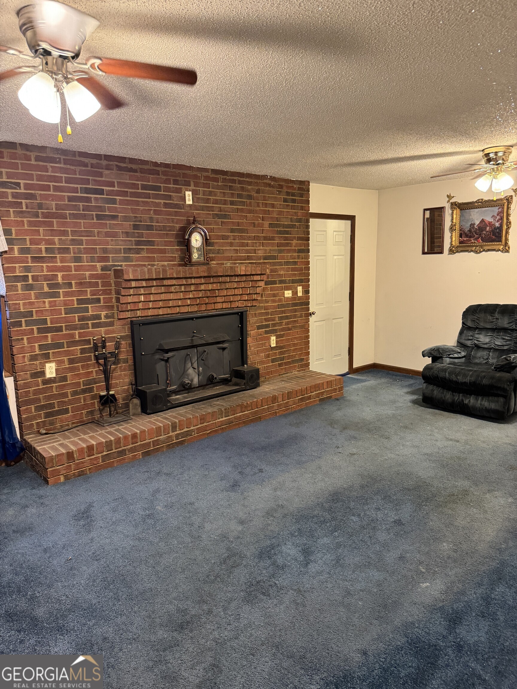 1936 Cedar Grove Road Soperton, GA 30457 - Photo 23 of 43 a living room with furniture and a fireplace