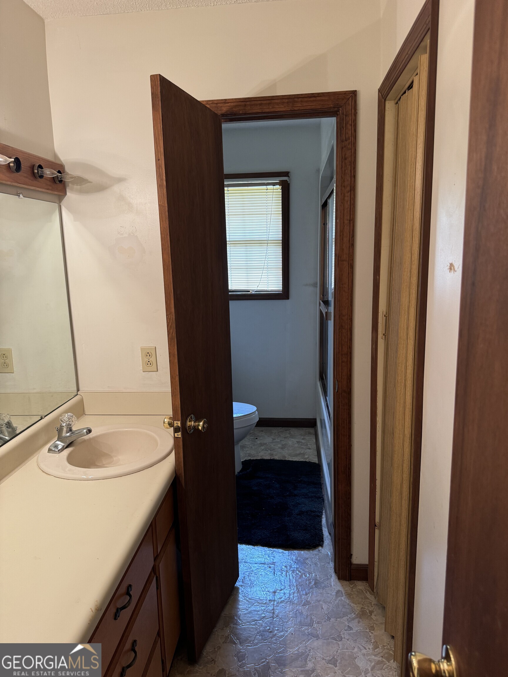 1936 Cedar Grove Road Soperton, GA 30457 - Photo 28 of 43 a bathroom with a sink a toilet and shower