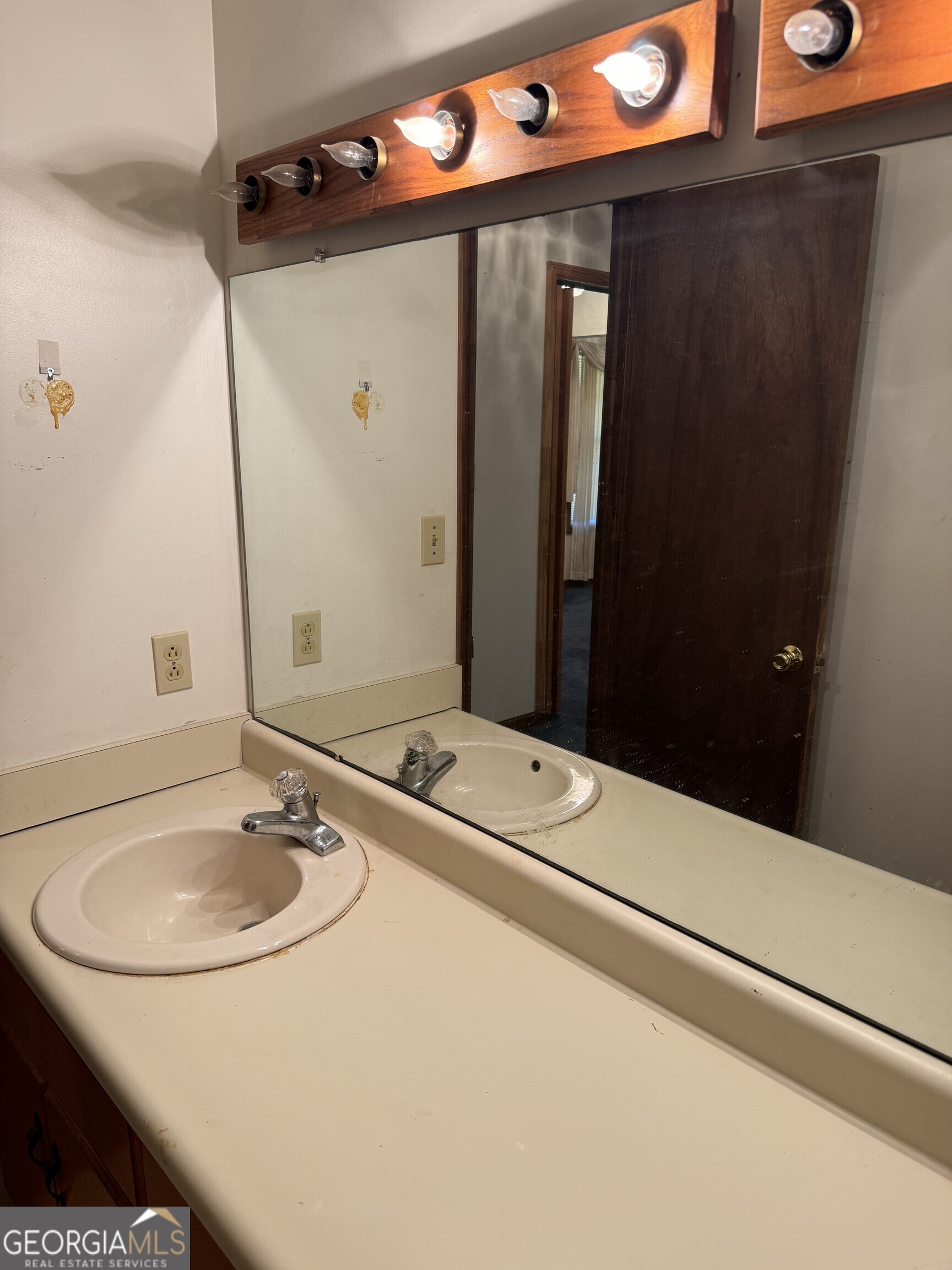 1936 Cedar Grove Road Soperton, GA 30457 - Photo 29 of 43 a bathroom with a sink and a mirror