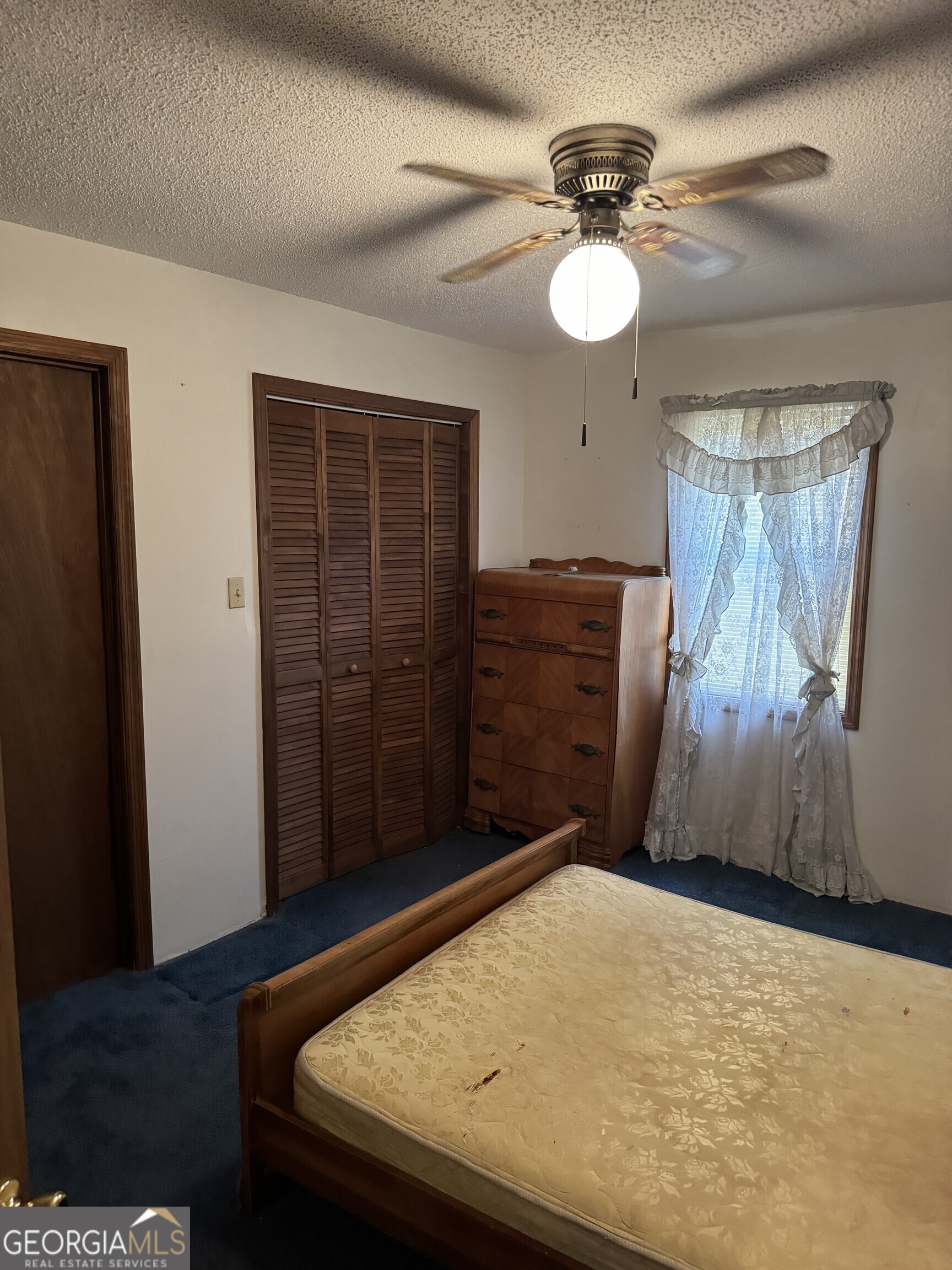 1936 Cedar Grove Road Soperton, GA 30457 - Photo 33 of 43 a view of a livingroom with a staircase