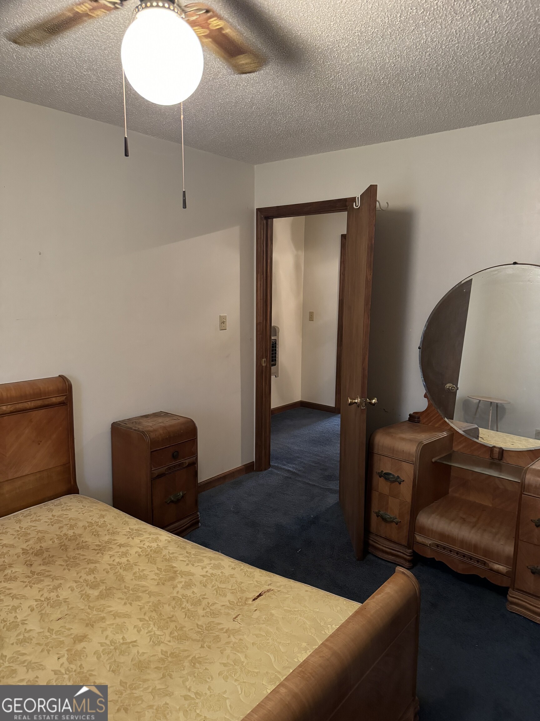 1936 Cedar Grove Road Soperton, GA 30457 - Photo 34 of 43 a bedroom with furniture and wooden floor