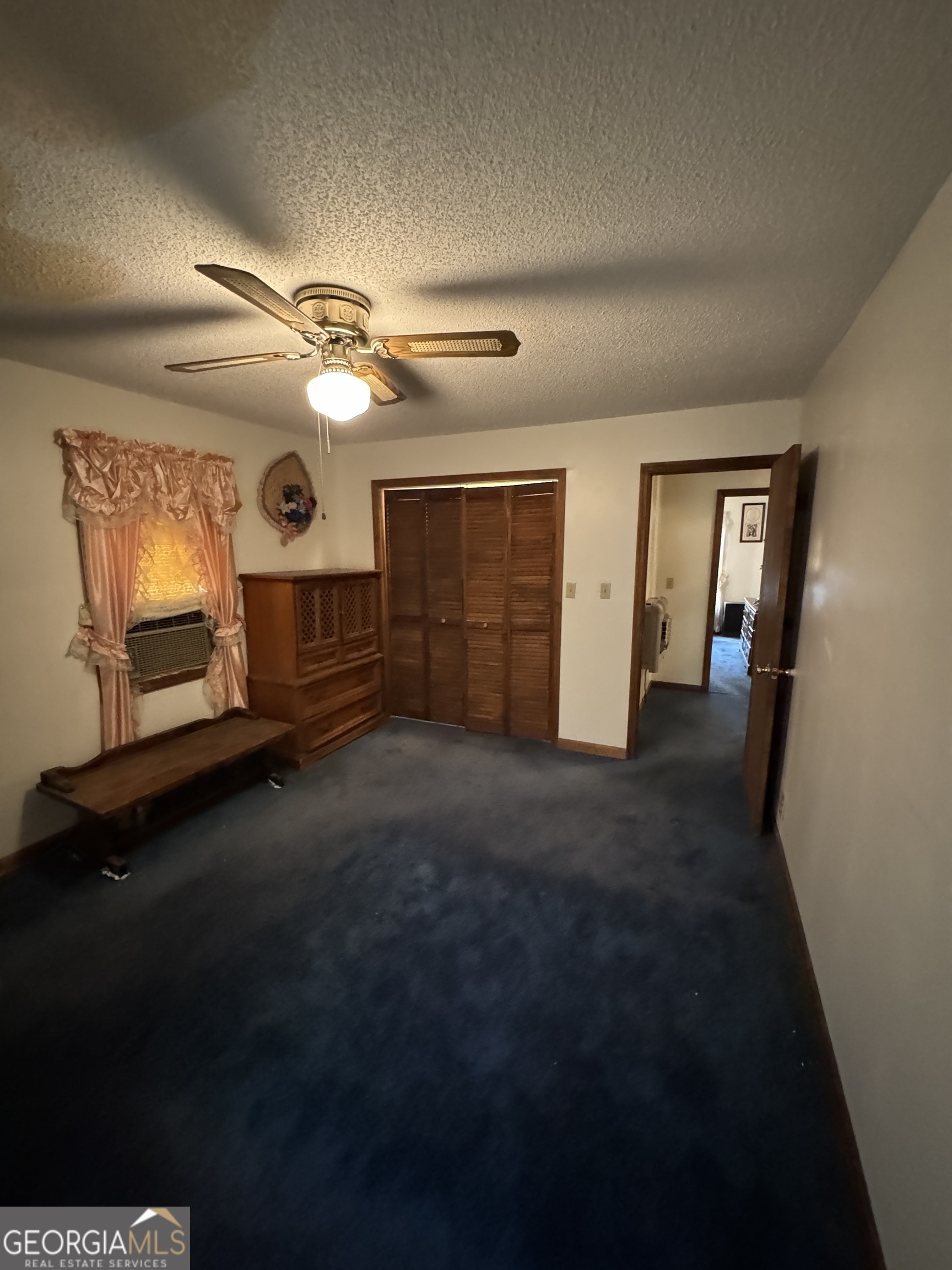1936 Cedar Grove Road Soperton, GA 30457 - Photo 35 of 43 wooden floor in an empty room with a fireplace