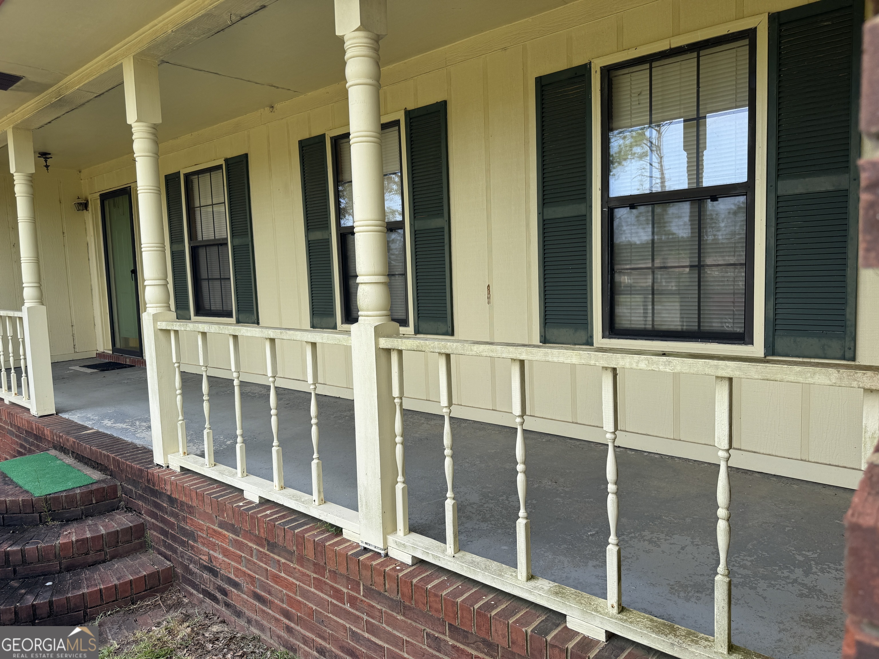 1936 Cedar Grove Road Soperton, GA 30457 - Photo 4 of 43 a view of a balcony with wooden floor