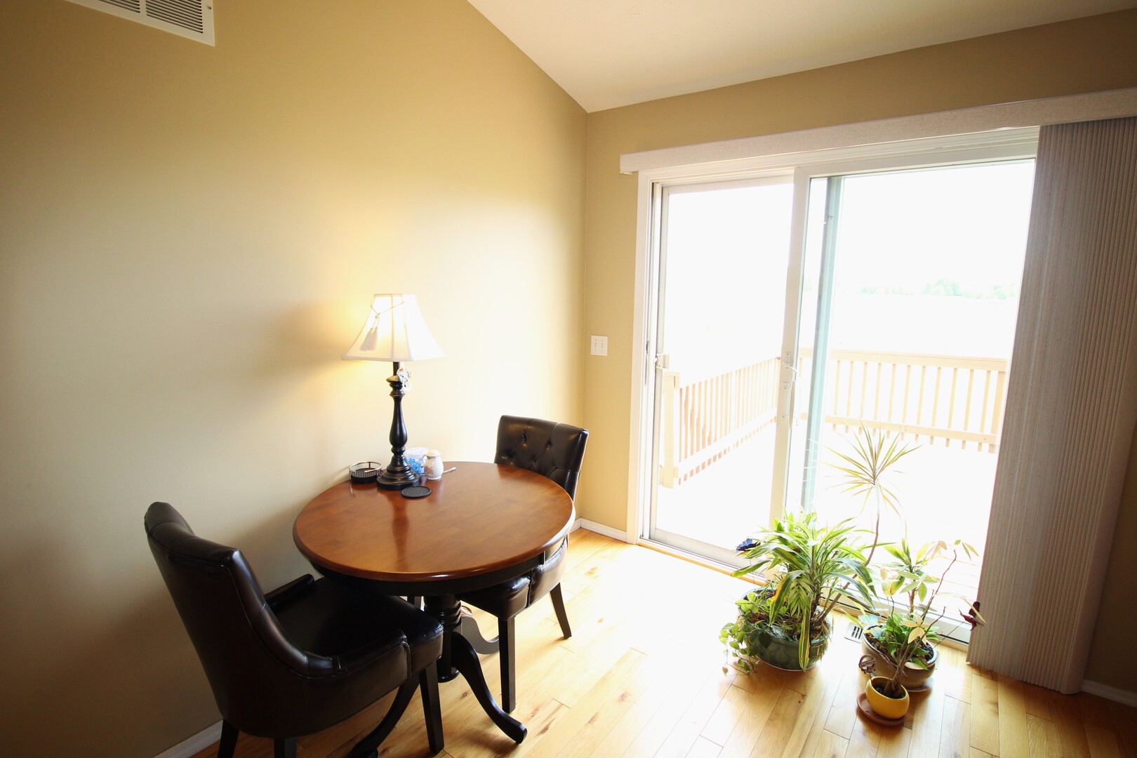 25 Oak Park Road Bloomington, IL 61701 - Photo 11 of 28 a dining room with furniture and wooden floor