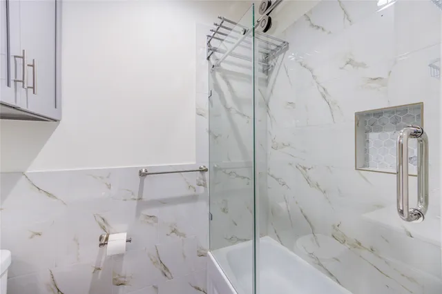 a bathroom with a sink a toilet and vanity