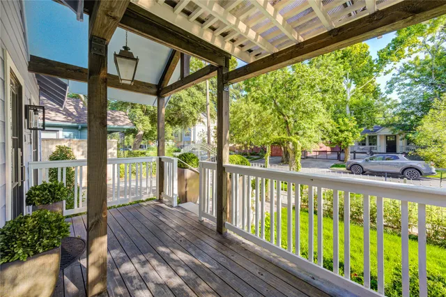 a view of a balcony with wooden floor
