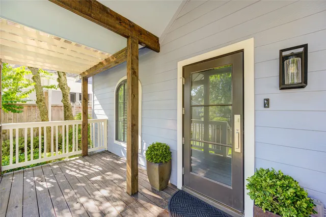 a view of a balcony with wooden floor