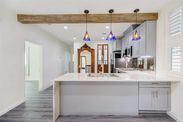 a view of living room with granite countertop furniture and window