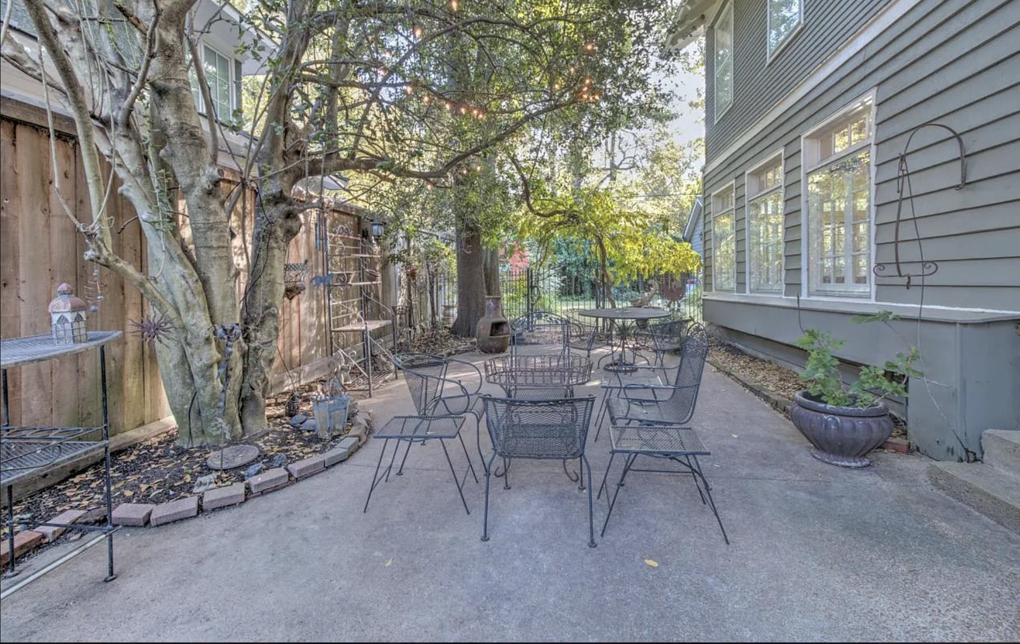 1515 Goodbar Avenue Memphis, TN 38104 - Photo 20 of 21 a view of a patio with table and chairs and potted plants