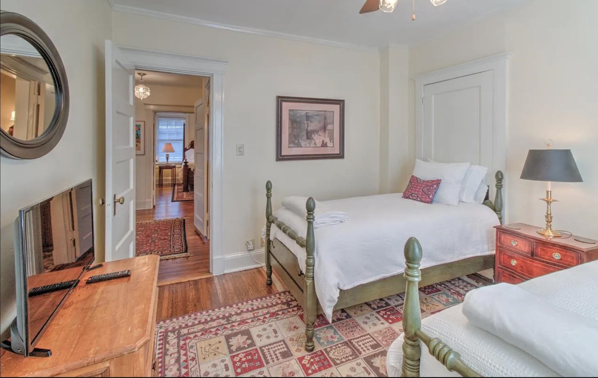 1515 Goodbar Avenue Memphis, TN 38104 - Photo 7 of 21 a bedroom with a bed and a chandelier