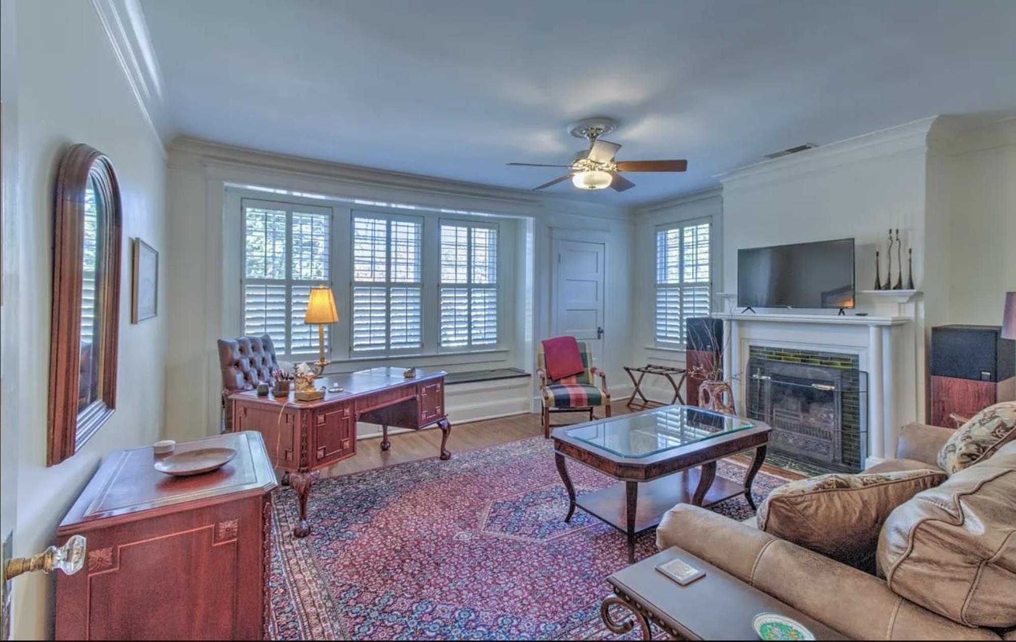 1515 Goodbar Avenue Memphis, TN 38104 - Photo 8 of 21 a living room with furniture a fireplace and a flat screen tv
