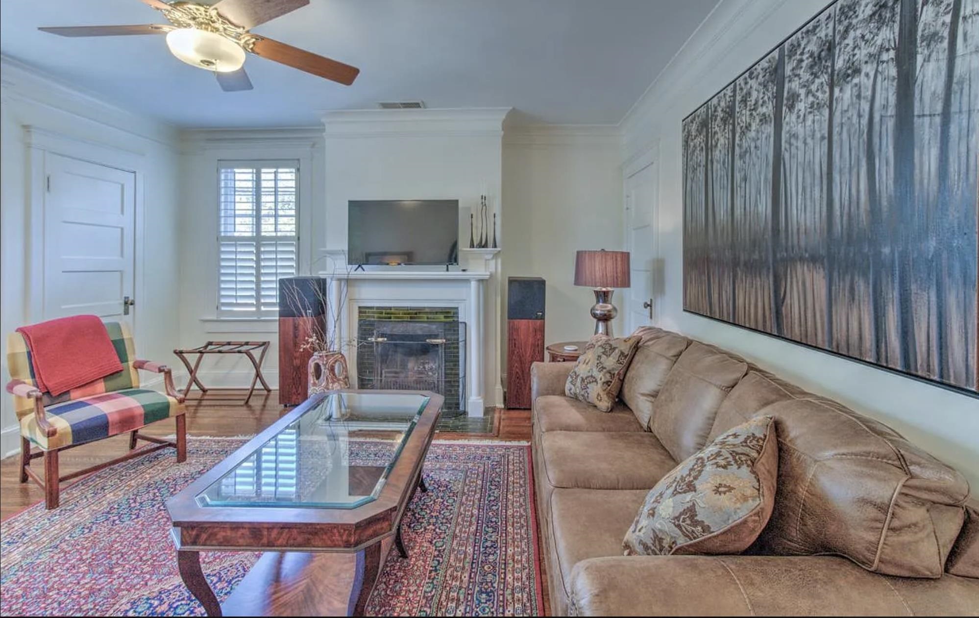 1515 Goodbar Avenue Memphis, TN 38104 - Photo 9 of 21 a living room with furniture a fireplace and a flat screen tv