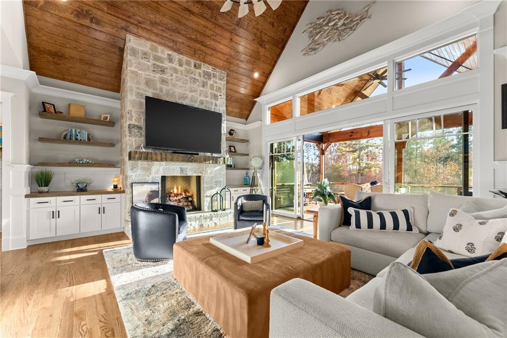 5431 Mayflower Court Gainesville, GA 30504 - Photo 16 of 64 a living room with fireplace furniture and a flat screen tv