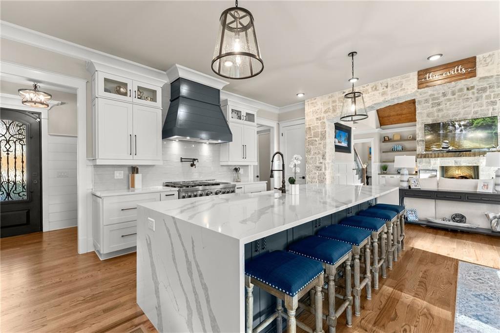5431 Mayflower Court Gainesville, GA 30504 - Photo 29 of 64 a kitchen with stainless steel appliances a stove a sink a refrigerator and cabinets