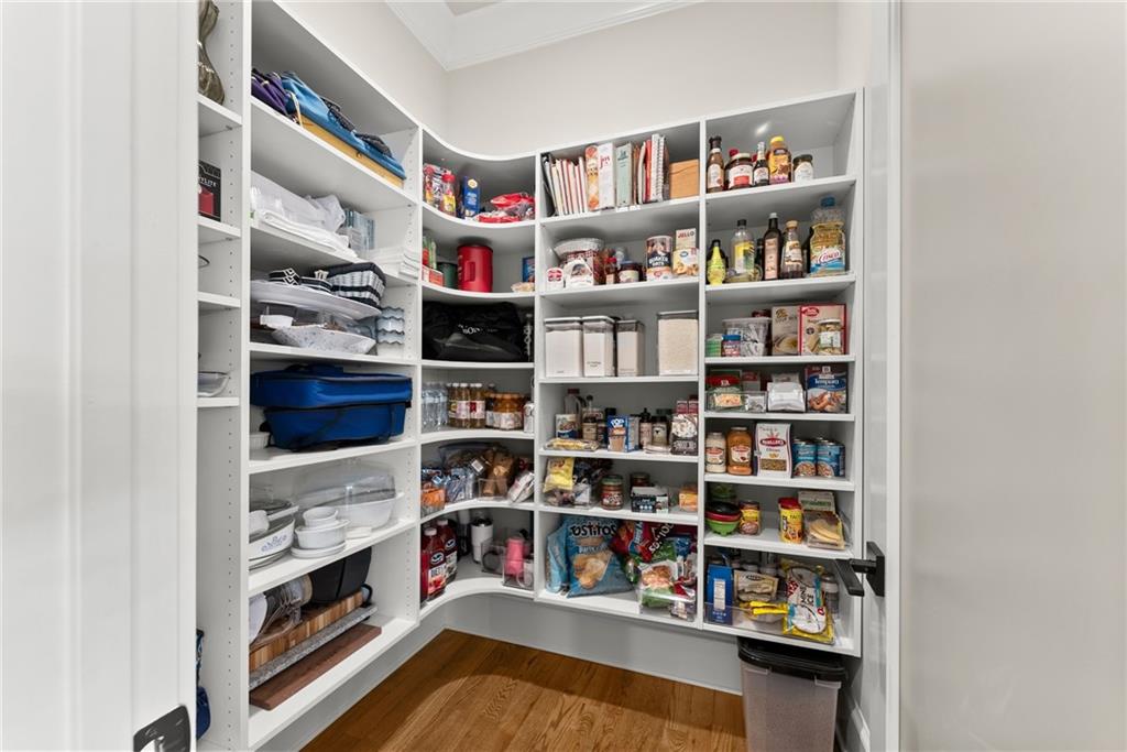 5431 Mayflower Court Gainesville, GA 30504 - Photo 31 of 64 a view of walk in closet with clothes and shoes