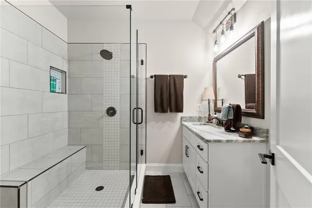 a living room with furniture a window and gym equipment