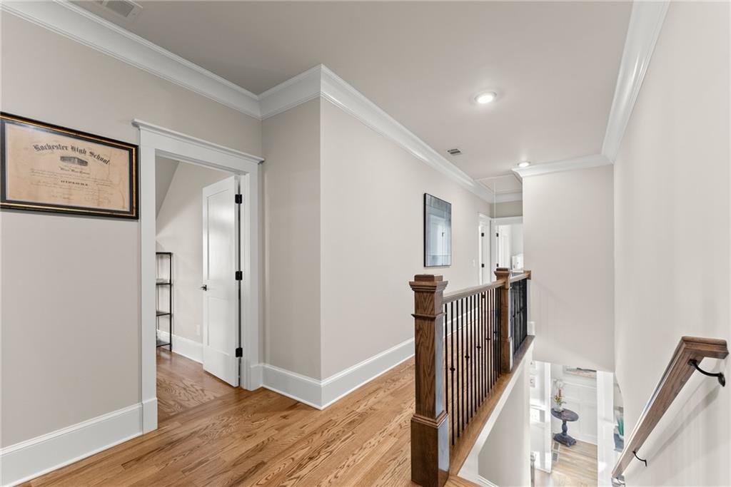 5431 Mayflower Court Gainesville, GA 30504 - Photo 42 of 64 a view of a hallway with wooden floor and staircase