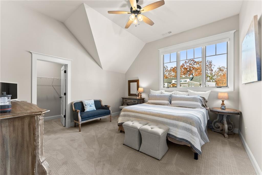 5431 Mayflower Court Gainesville, GA 30504 - Photo 44 of 64 a bedroom with a bed and a chandelier