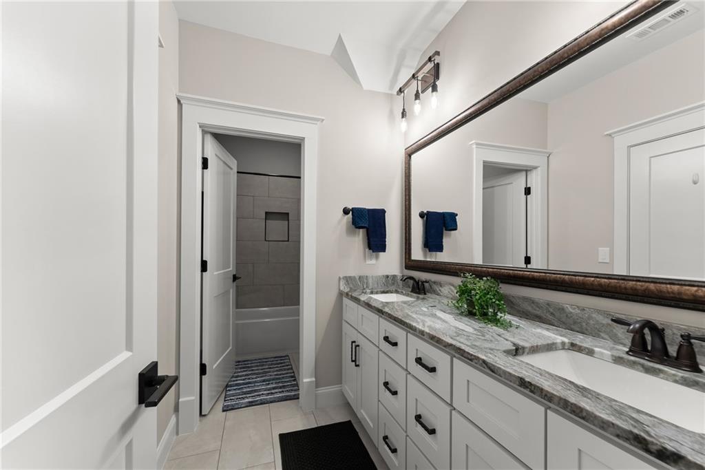 5431 Mayflower Court Gainesville, GA 30504 - Photo 45 of 64 a bathroom with a granite countertop sink mirror and double