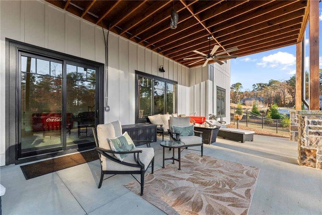 5431 Mayflower Court Gainesville, GA 30504 - Photo 52 of 64 a living room with furniture and a large window