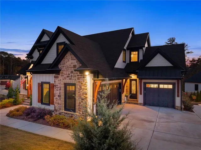a living room with furniture a lamp and a fireplace