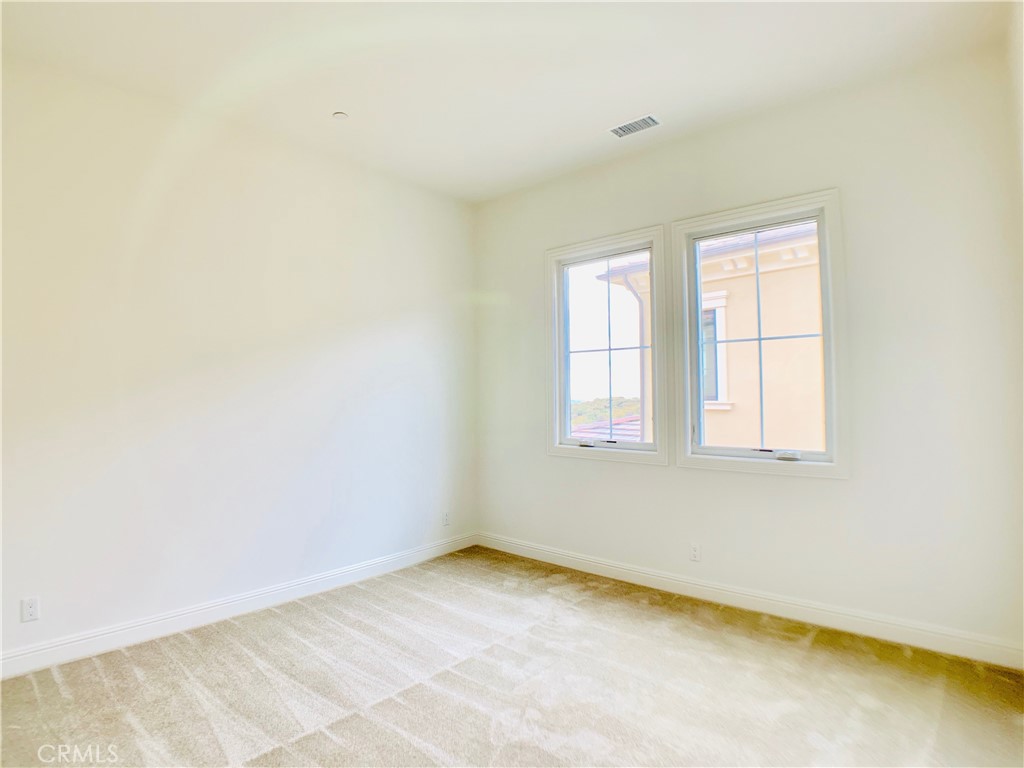 152 Leafy Pass Irvine, CA 92602 - Photo 33 of 55 an empty room with a window