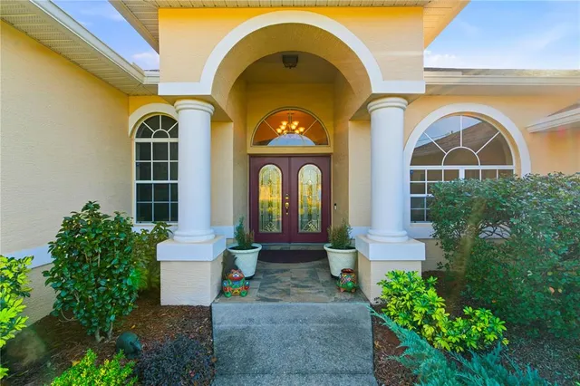 a living room with furniture and flowers