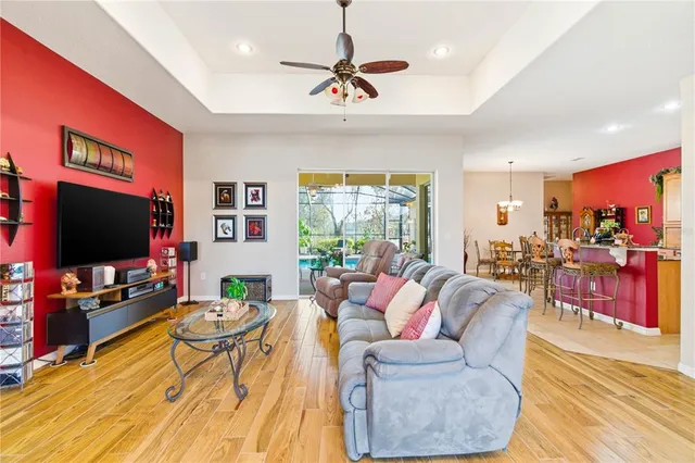 a bathroom with a tub a mirror and a shower