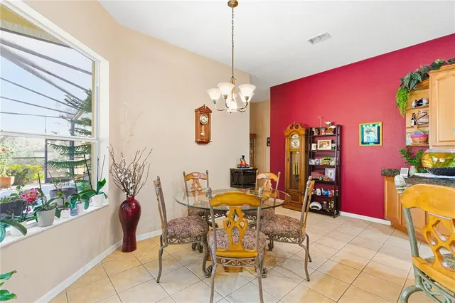 a view of a patio with swimming pool table and chairs