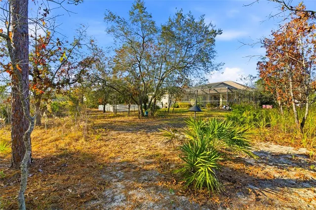 a view of a dining room with furniture and a window