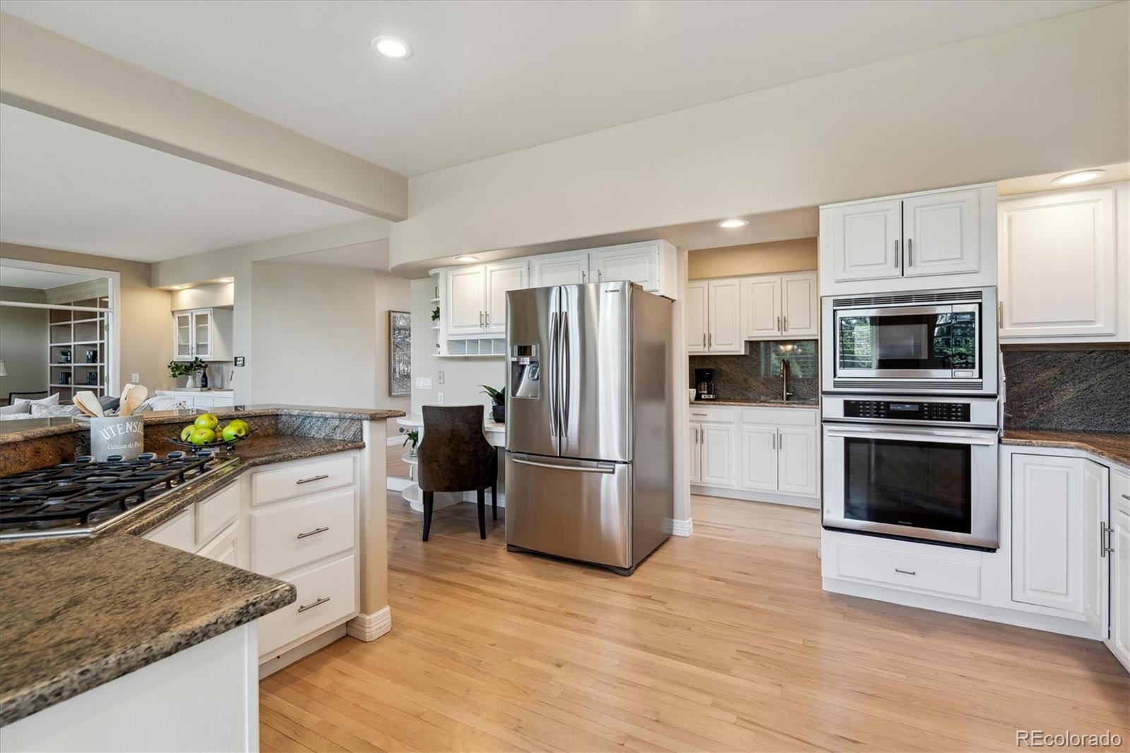 72 Falcon Hills Drive Highlands Ranch, CO 80126 - Photo 13 of 49 a kitchen with a sink stainless steel appliances and cabinets