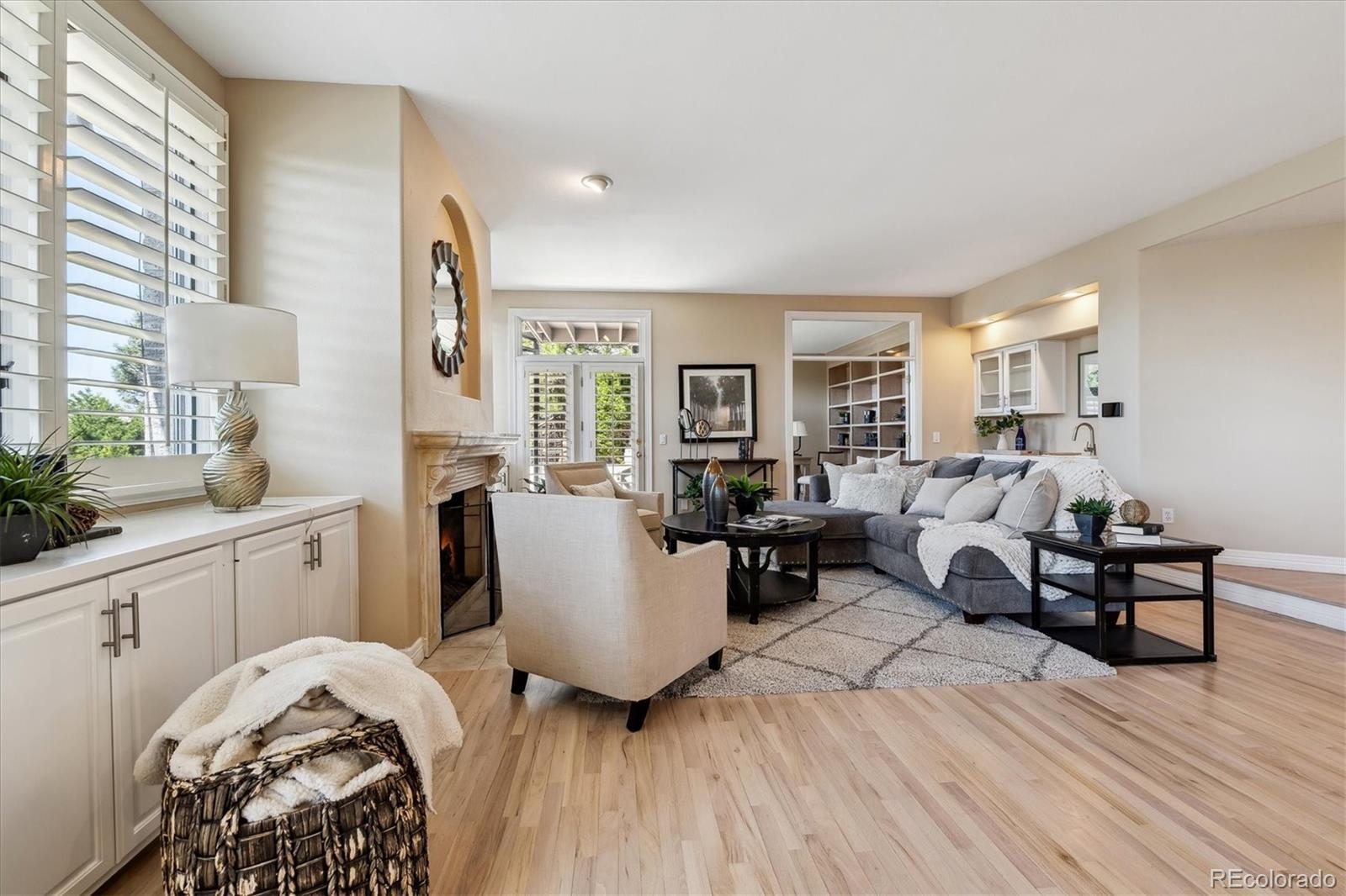 72 Falcon Hills Drive Highlands Ranch, CO 80126 - Photo 20 of 49 a bedroom with furniture and a wooden floor