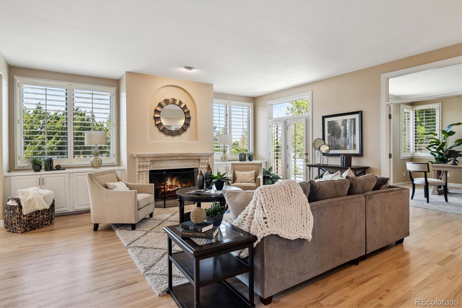 72 Falcon Hills Drive Highlands Ranch, CO 80126 - Photo 24 of 49 a living room with furniture a fireplace and window