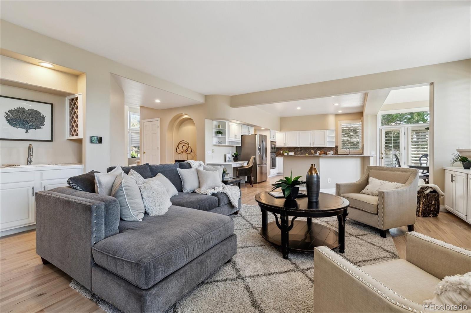 72 Falcon Hills Drive Highlands Ranch, CO 80126 - Photo 25 of 49 a living room with furniture and a large window