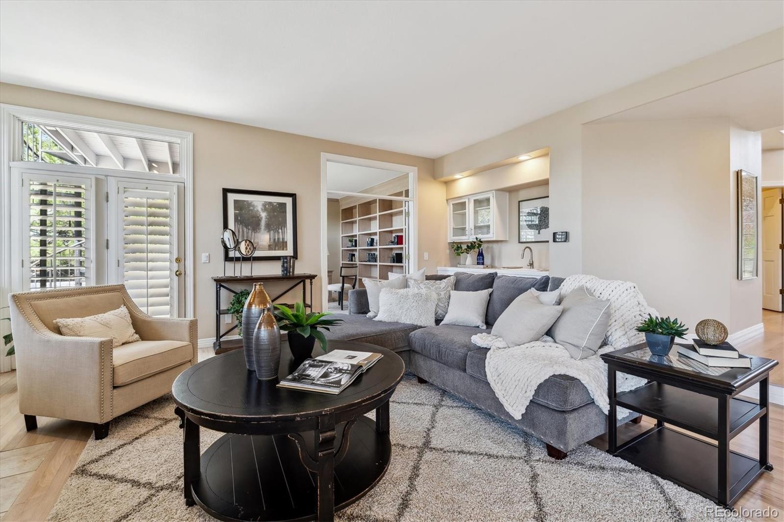 72 Falcon Hills Drive Highlands Ranch, CO 80126 - Photo 26 of 49 a living room with furniture and a potted plant
