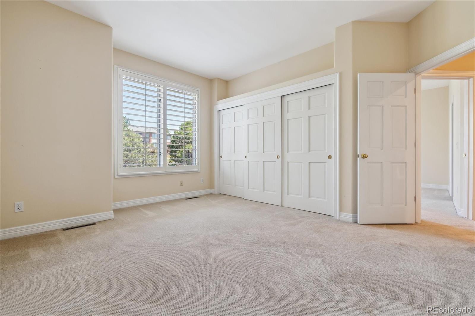 72 Falcon Hills Drive Highlands Ranch, CO 80126 - Photo 30 of 49 an empty room with windows