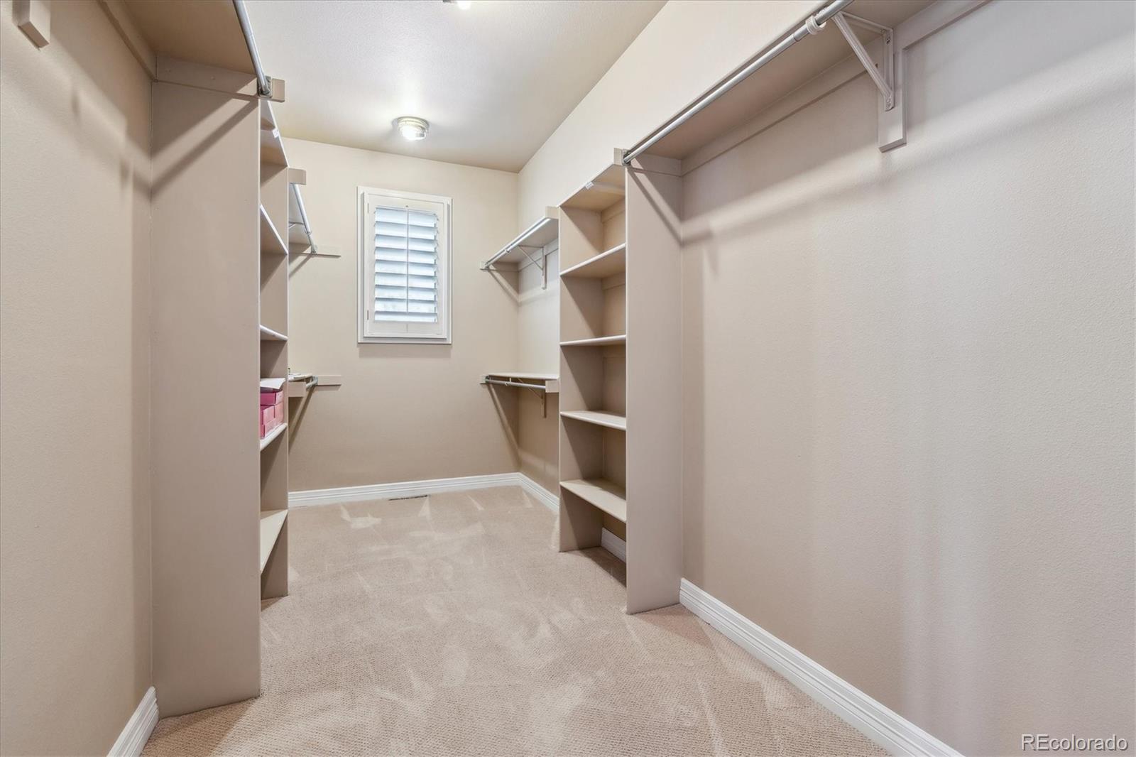 72 Falcon Hills Drive Highlands Ranch, CO 80126 - Photo 37 of 49 a view of an empty walk in closet