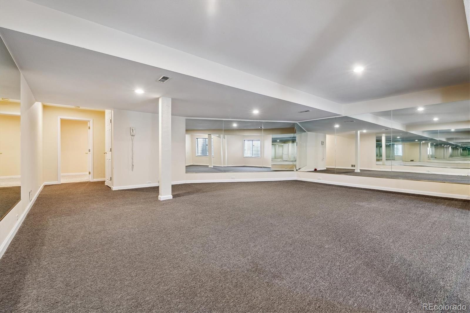 72 Falcon Hills Drive Highlands Ranch, CO 80126 - Photo 38 of 49 a view of an empty room with a window