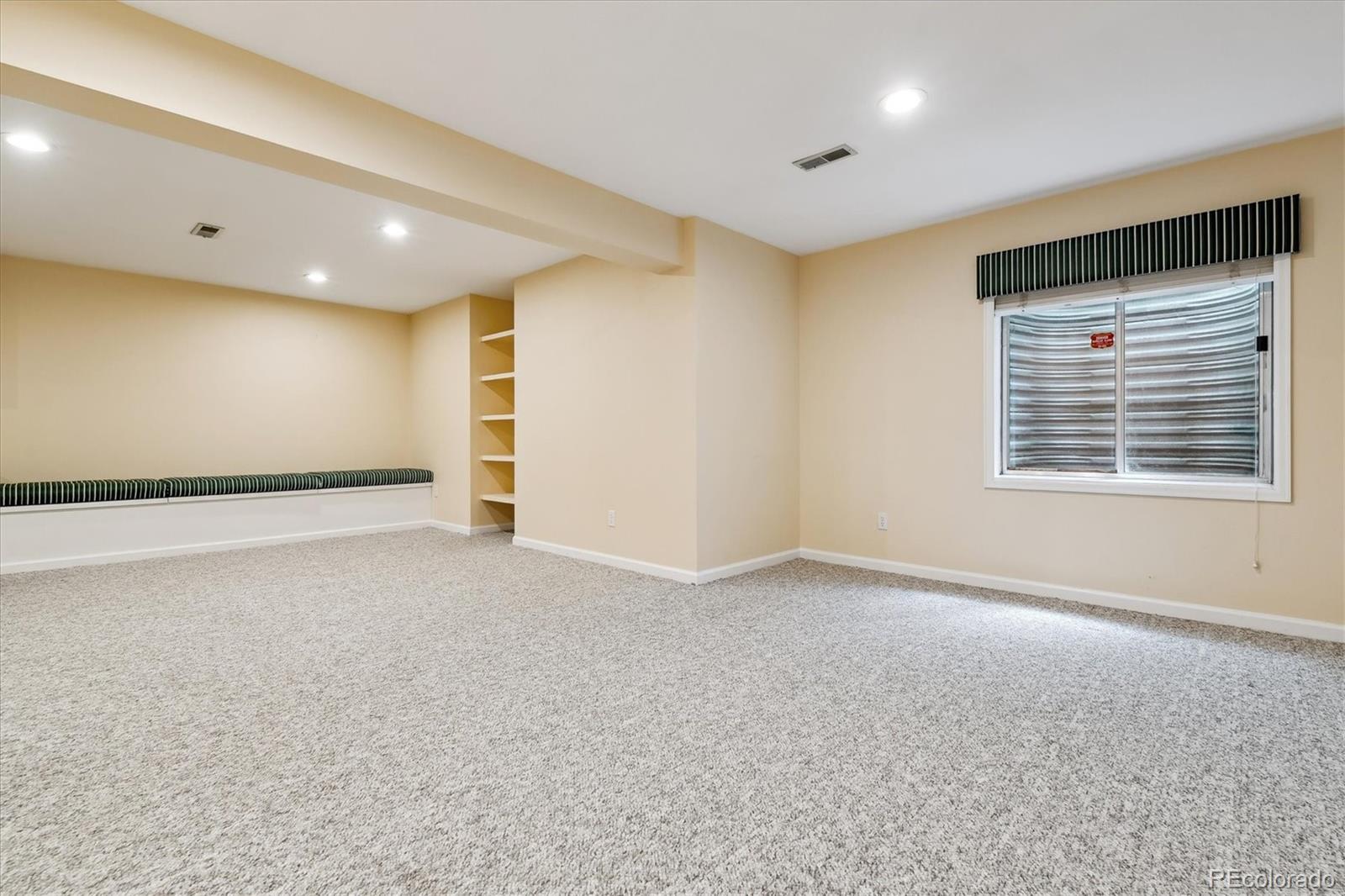 72 Falcon Hills Drive Highlands Ranch, CO 80126 - Photo 40 of 49 a view of an empty room with a window